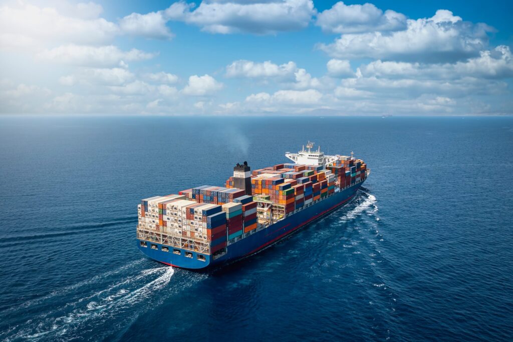 A,Large,Container,Cargo,Ship,Travels,Over,Calm,,Blue,Ocean
