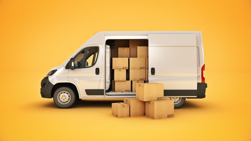 white delivery van loaded with cardboard boxes against yellow background